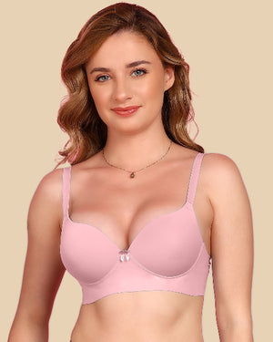 Woman wearing a pink bra against a beige background