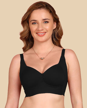 Woman wearing a black bra on a beige background
