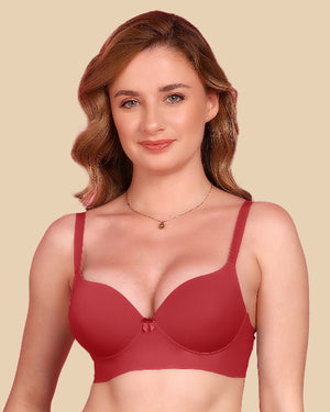 Woman wearing a red bra against a beige background