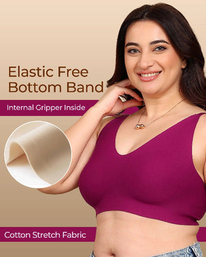 Woman wearing a purple bra with text about elastic free bottom band and cotton stretch fabric.