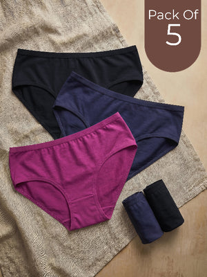 Pack of 5 women's underwear including black, purple, and navy pairs on a textured surface.