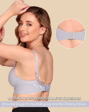 Woman wearing a gray bra with close-up details on a beige background