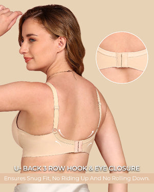 Woman wearing a beige bra with close-up of back closure on a beige background
