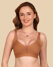 Woman wearing a brown bra against a beige background
