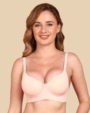 Woman wearing a beige bra against a beige background
