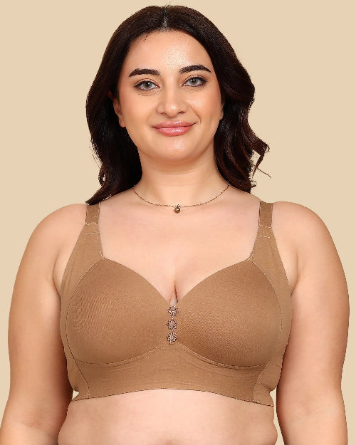 Woman wearing a beige bra against a beige background
