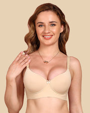 Woman wearing a beige bra against a beige background