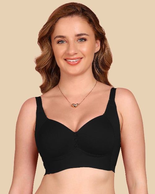 Woman wearing a black bra on a beige background