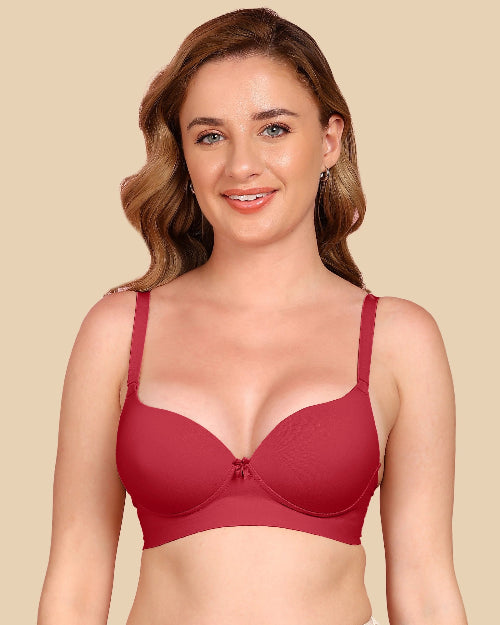 Woman wearing a red bra against a beige background