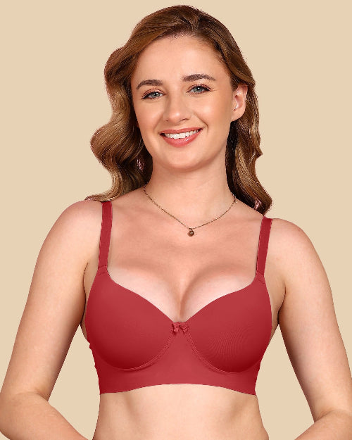Woman wearing a red bra against a beige background