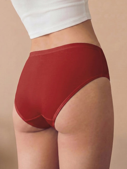 Red underwear worn by a person on a beige background