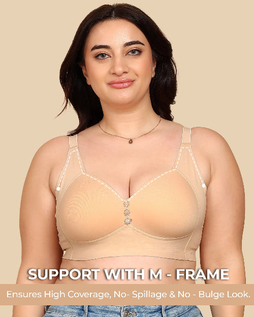 Woman wearing a beige M-frame support bra on a beige background