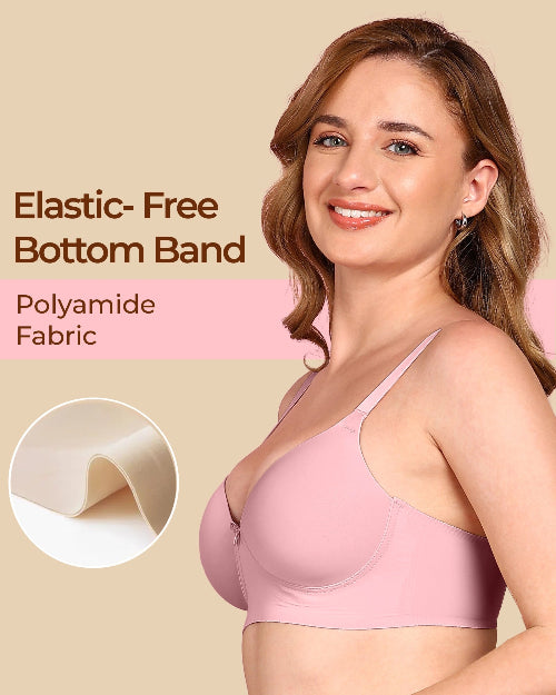 Woman wearing a pink bra with text about elastic-free bottom band and polyamide fabric.