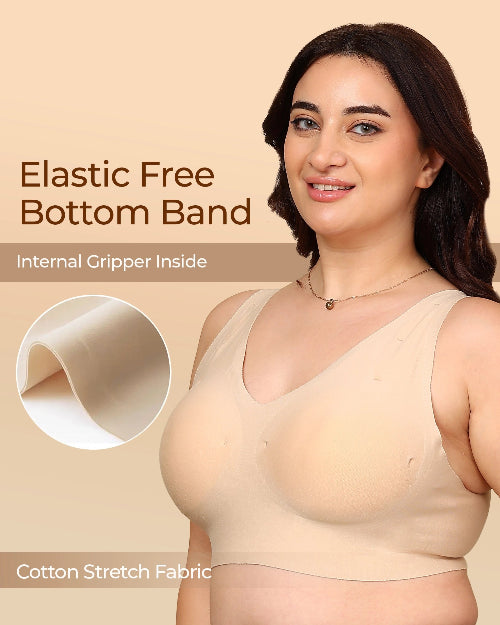 Woman wearing a beige compression garment with text about elastic free bottom band and cotton stretch fabric.