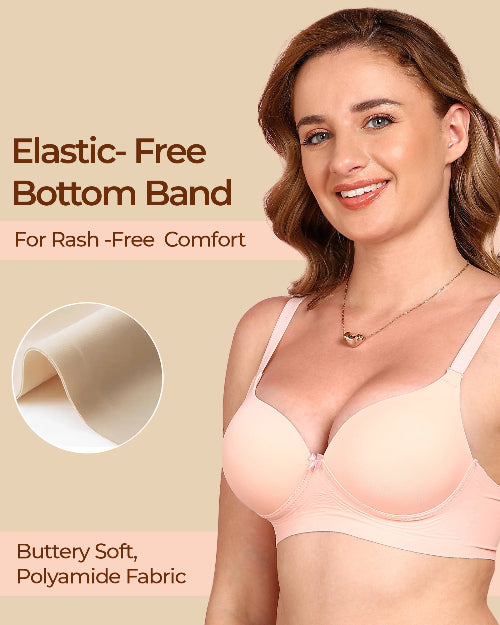 Woman wearing a pink bra with text about elastic-free bottom band and buttery soft polyamide fabric.