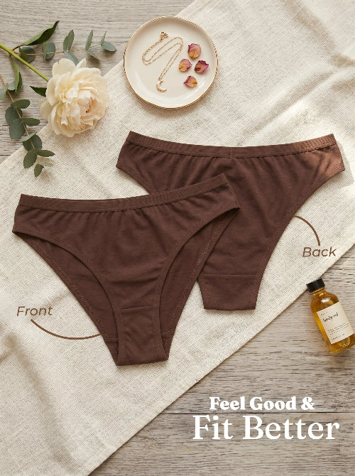 Brown underwear set on a textured surface with decorative elements.