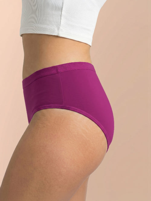 Purple underwear worn by a person on a beige background