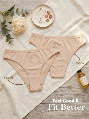 Beige underwear on a textured surface with decorative elements and text 'Feel Good & Fit Better'.