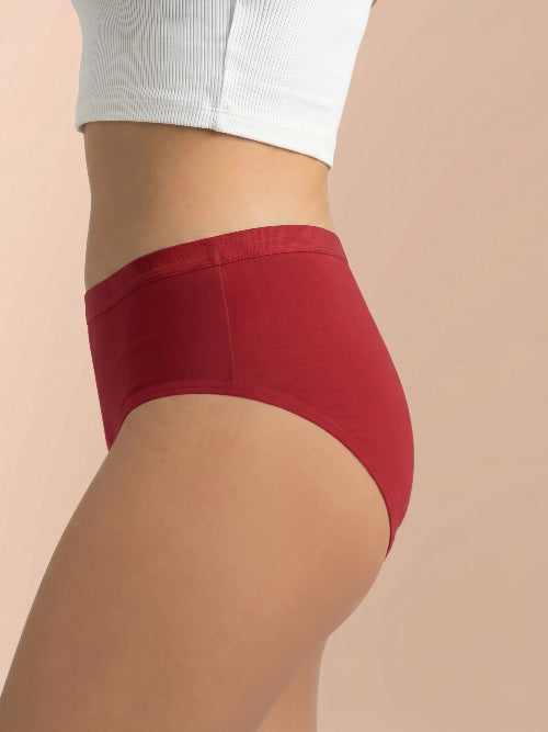 Red underwear worn by a person on a beige background