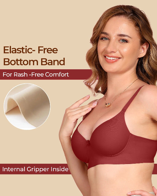 Woman wearing a maroon bra with text about elastic-free bottom band and internal gripper on a beige background