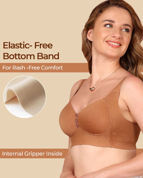 Woman wearing a brown bra with text about elastic-free bottom band and rash-free comfort.