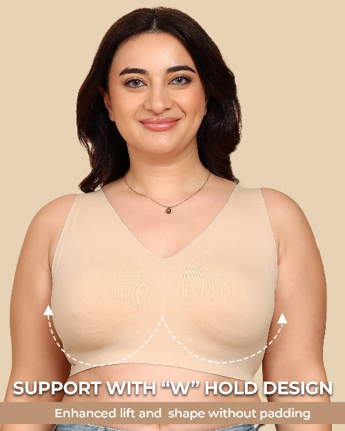 Woman wearing a beige tank top with text highlighting 'W' hold design on a beige background