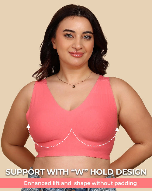 Woman wearing a pink sports bra with text highlighting design features on a beige background