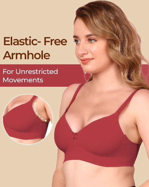 Woman wearing a red bra with an elastic-free armhole feature on a beige background.