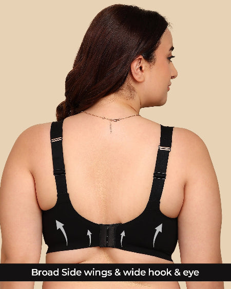 Black bra with wide hook and eye on a beige background