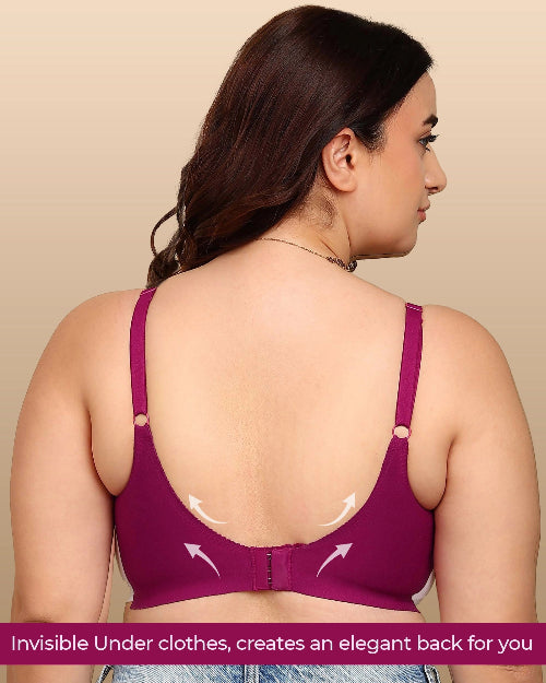 Woman wearing a purple bra with an elegant back design on a beige background