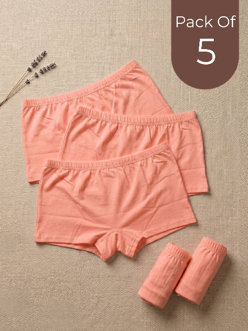Pack of 5 pink women's underwear on a beige background