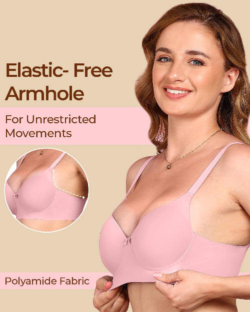 Woman wearing a pink bra with text highlighting elastic-free armhole design on a beige background