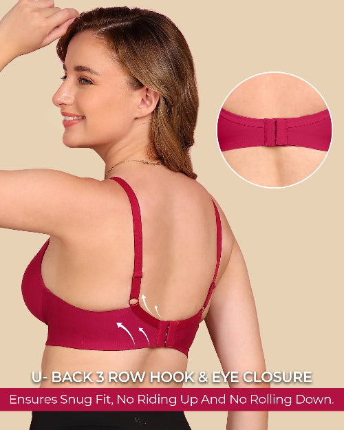 Woman wearing a red bra with a close-up of the U-back design on a beige background.