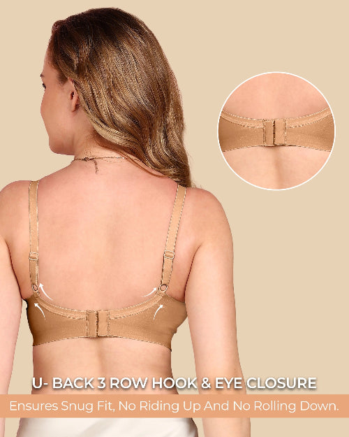 Woman wearing a beige bra with U-back 3 row hook & eye closure on a beige background.