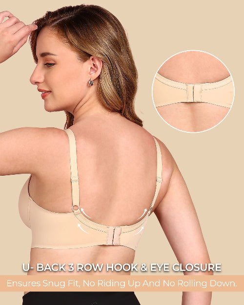 Woman wearing a beige bra with close-up of back closure on a beige background