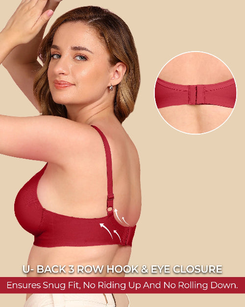 Woman wearing a red bra with a close-up of the U-back closure mechanism on a beige background.
