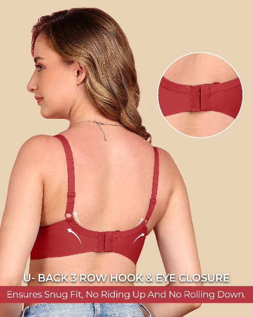 Woman wearing a red bra with a close-up of the U-back closure on a beige background.